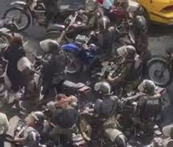 A grab from the video in which security forces harassed a female protester (October 2022)