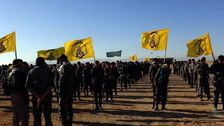 Fatemiyoun brigade fighters showcasing their flag in Syria (December 2016)  