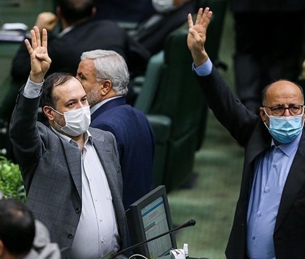 Lawmakers raising their hands in parliament session. January 9, 2022