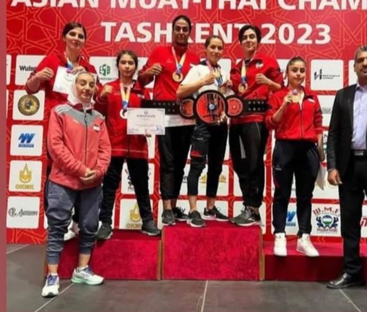 Iran's national women's muay thai team standing on podium without mandatory hijab at the Asian Championships held in Tashkent, Uzbekistan's capital