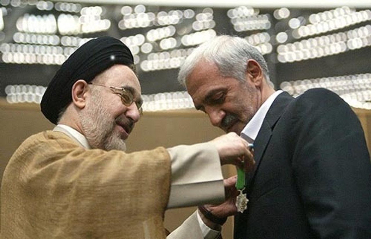Former President of Iran&acirc;s Football Federation Mohammad Dadkan receiving a medal from former president Mohammad Khatami  