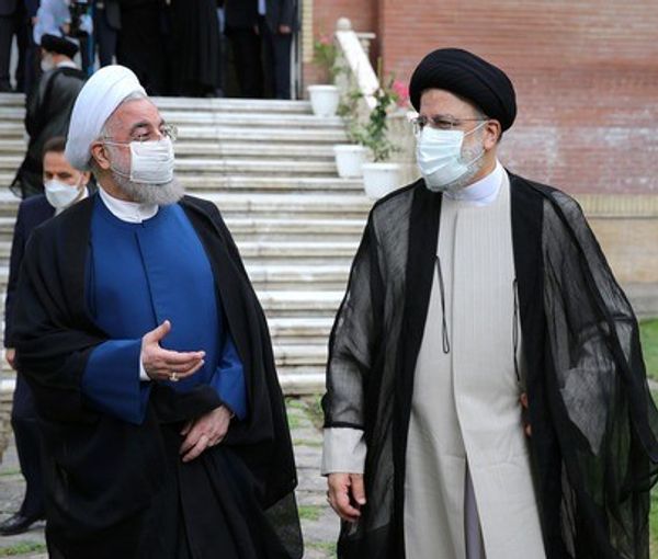 Former president Hassan Rouhani and President Ebrahim Raisi in August 2021
