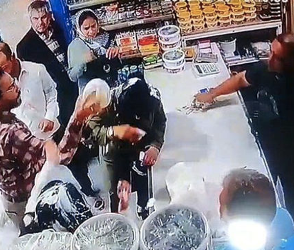 A screengrab from the CCTV camera of the shop where women were attacked in the city of Shandiz (March 2023)