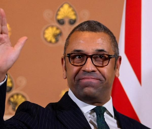 British Foreign Secretary James Cleverly gestures as he speaks to members of the press in London, December 12, 2022