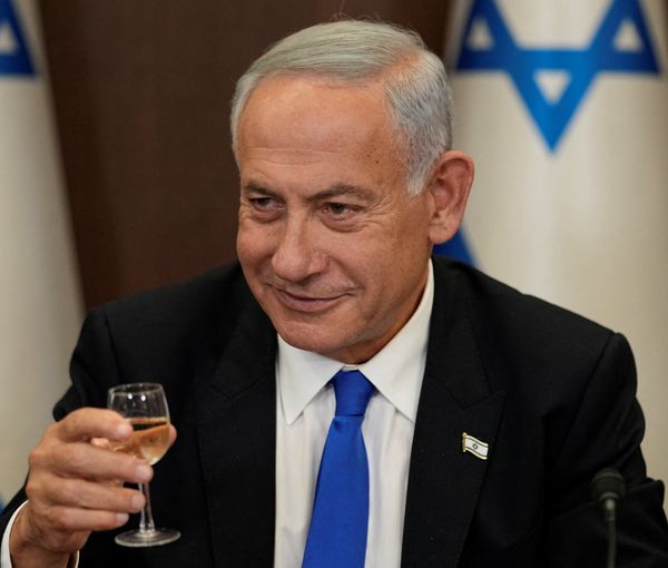 Newly sworn in Israeli Prime Minister Benjamin Netanyahu makes a toast during a cabinet meeting in Jerusalem, December 29, 2022