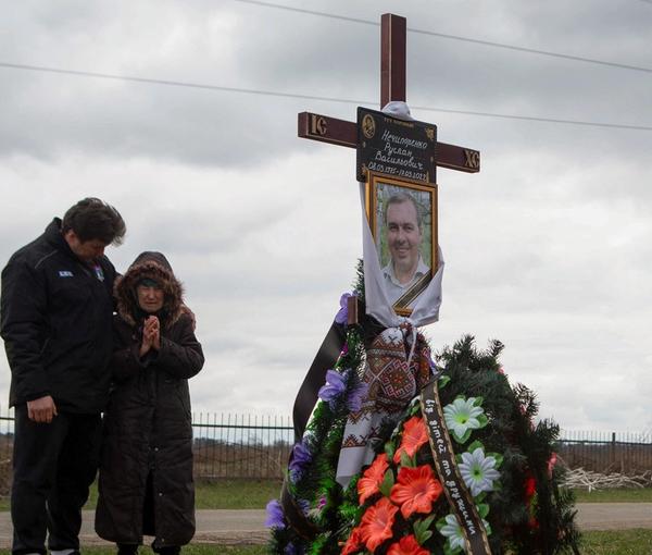 At the grave of a man killed in Bucha, Ukraine. April 18, 2022
