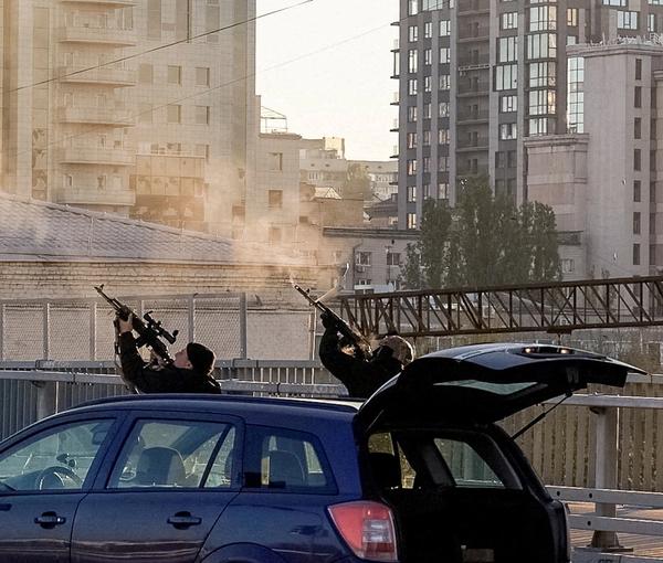 Ukrainian policemen firing at Iranian drones over Kyiv on October 17, 2022