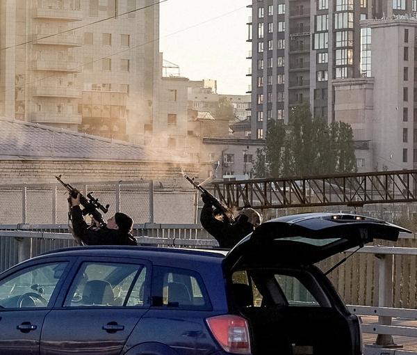 Ukrainian policemen in Kyiv firing on Iranian drones over the city on October 17, 2022