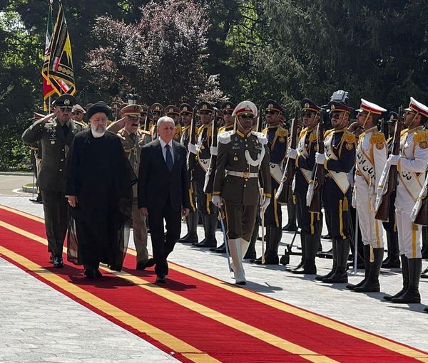 Iraqi President Abdul Latif Rashid and Iranian President Ebrahim Raisi, review an honor guard, during his official arrival ceremony in Tehran, April 29, 2023
