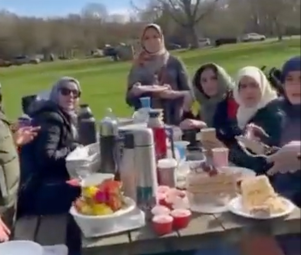 A screengrab from the video of the Iranian ambassador and embassy staff in London picnicking and eating during Ramadan  (April 2023)