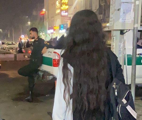 An Iranian woman unveiling in protest to the mandatory hijab (November 2022)