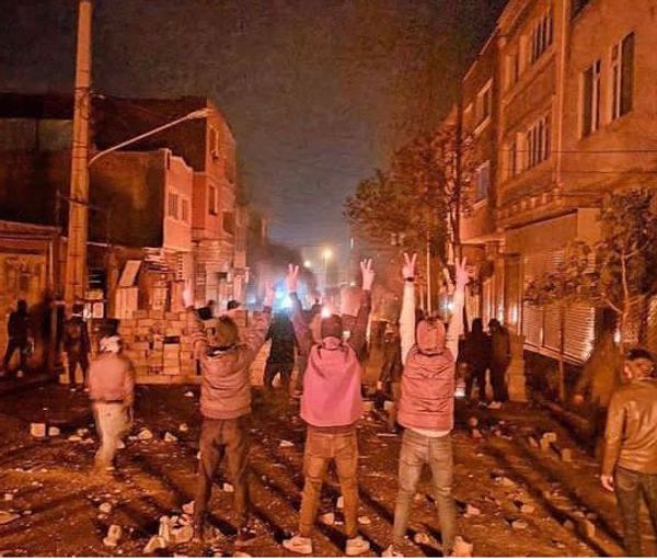 People block a street during protests (November 2022)