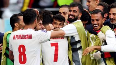 The Iranian team celebrates after its win against Wales on November 25, 2022