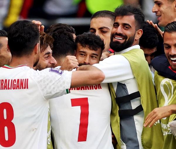 The Iranian team celebrates after its win against Wales on November 25, 2022