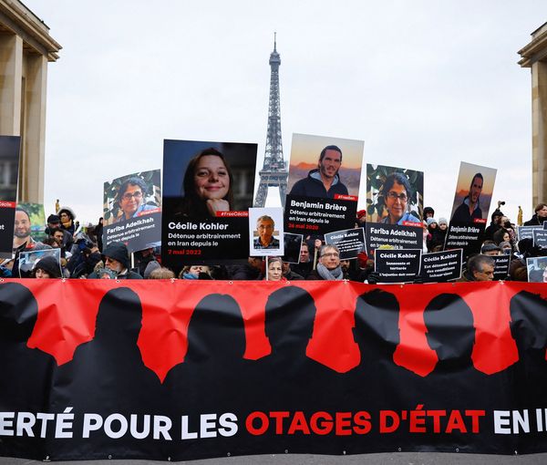 Supporters and relatives of French citizens detained in Iran, Cecile Kohler, Benjamin Briere, Jacques Paris and Fariba Adelkhah, gather in front of the Eiffel Tower, during a rally demanding their release, in Paris, France, January 28, 2023.