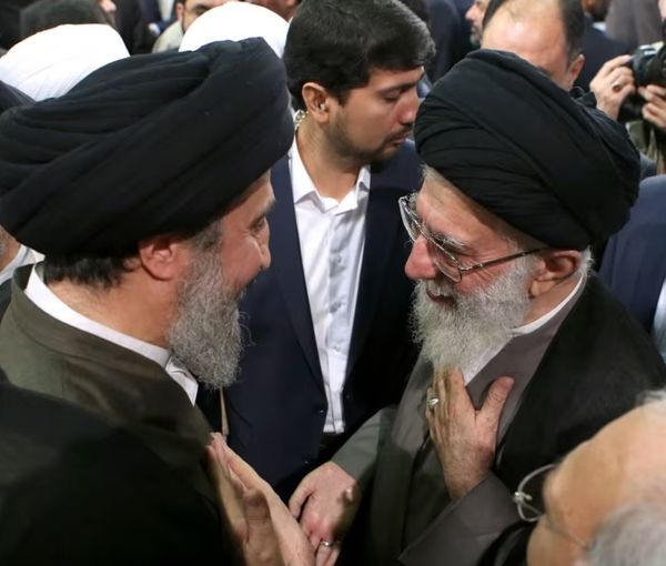 Hameed al-Hussaini, the director Iraq’s section of the Islamic Radio and Television Union, and Iran’s Supreme Leader Ali Khamenei (right)  (undated)