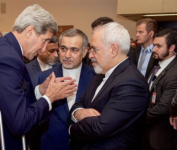 Former US secretary of state John Kerry seen speaking with J. Zarif and Hassan Fereydoun (C). Undated