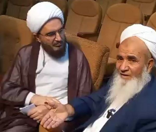 Sunni cleric Molavi Abdolvahed (Abdulwahid) Rigi (right) during a meeting with the visiting representative of Supreme Leader Ali Khamenei in November 2022