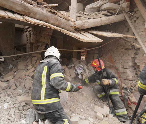Rescuers work at a site of residential buildings destroyed by a Russian missile strike, in Lviv region. March 9, 2023