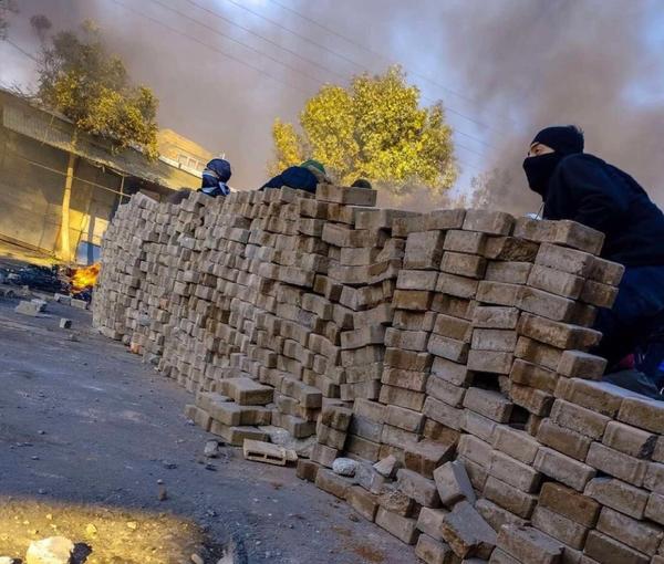 Protesters have set up a barricade in Mahabad, western Iran on Nov. 19, 2022