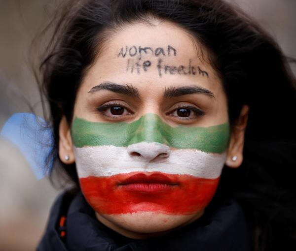 An Iranian woman seen during protests in Brussels demanding action against the regime, on February 20, 2023