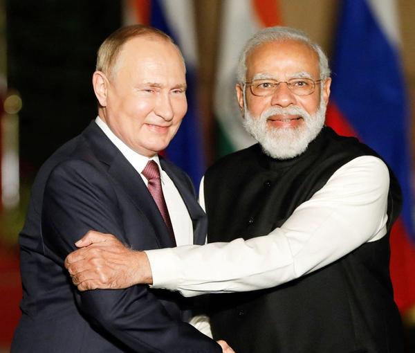 Russia's President Vladimir Putin shakes hands with India's Prime Minister Narendra Modi ahead of their meeting at Hyderabad House in New Delhi, India, December 6, 2021. 