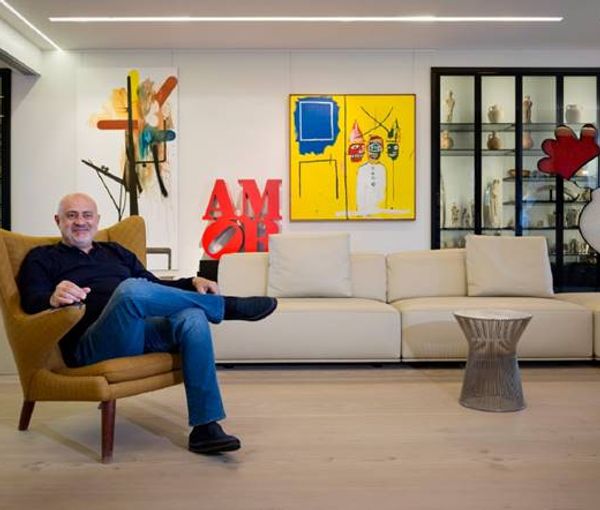 Nazem Said Ahmad in his penthouse in Beirut surrounded by artworks. Undated