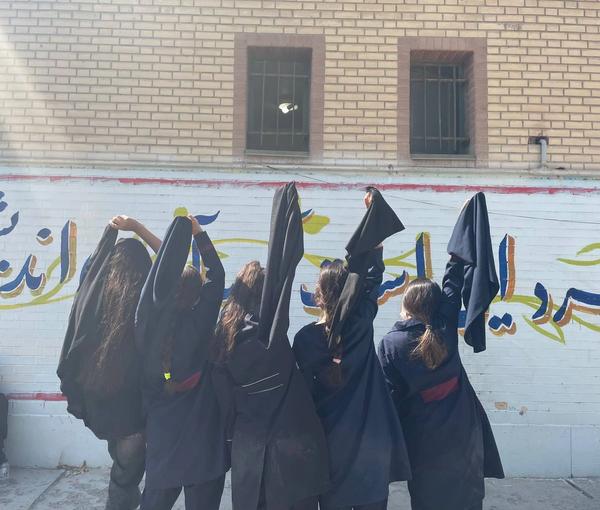 A group of students unveiling at school in support of the ongoing protests across Iran  (October 2022)