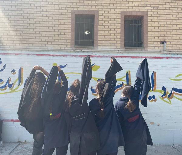 A group of students unveiling at school in support of the ongoing protests across Iran (October 2022)