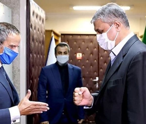 Rafael Grossi (L) meeting with Iran's nuclear chief Mohammad Eslami in Tehran in March 2022