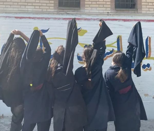 A group of schoolgirls removing their hijab in support of popular protests  (file photo)