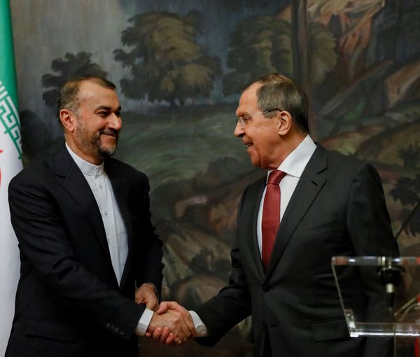 Russian Foreign Minister Sergei Lavrov shakes hands with Iranian Foreign Minister Hossein Amir-Abdollahian during a news conference following their meeting in Moscow, Russia March 29, 2023.