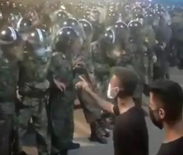 Protesters in Iran confronting a throng of security forces . Undatred