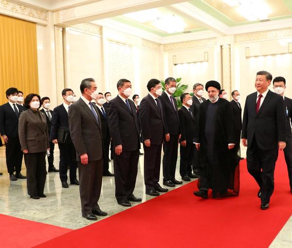 Iranian President Ebrahim Raisi walks with Chinese President Xi Jinping during a welcoming ceremony in Beijing, China, February 14, 2023