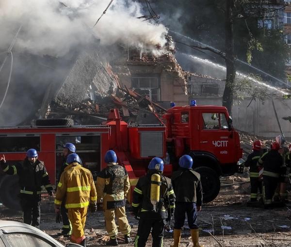 Ukranian emergency services deal with the aftermath of a Russian drone attack in Kyiv (October 2022)