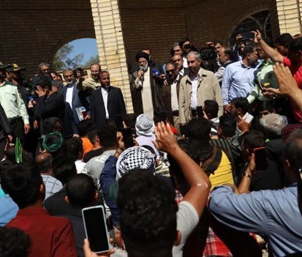 Iranian President Ebrahim Raisi (center) addressing the workers of Haft-Tappeh Sugarcane complex on April 27, 2023