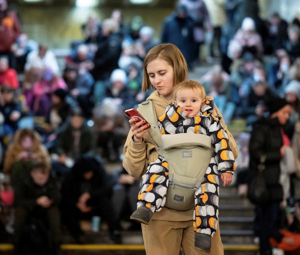 People take shelter inside a metro station during massive Russian missile attacks in Kyiv, December 29, 2022
