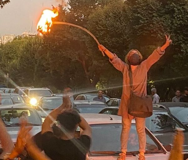 The first day of large anti-regime protests in Iran, as a young woman burns her headscarf in central Tehran. Sept. 19, 2022