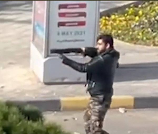 An anti-riot special soldier firing at protesters in Esfahan. November 26, 2021