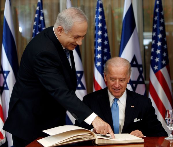 Then Vice President Joe Biden (right) prepares to sign the guest book before his meeting with Israel's Prime Minister Benjamin Netanyahu in Jerusalem March 9, 2010.
