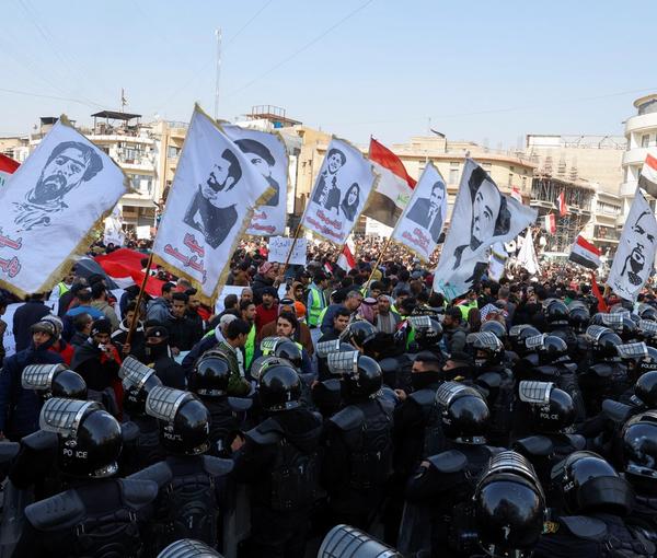 Protesters demonstrate against the dinar's slide in value, near the central bank in Baghdad, January 25, 2023