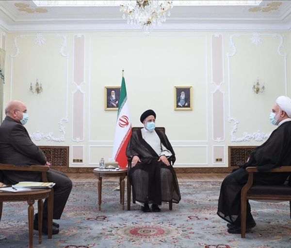 Iran’s President Ebrahim Raisi (center), Parliament Speaker Mohammad-Bagher Ghalibaf (left), and Chief Justice Gholam-Hossein Mohseni-Ejei during a meeting