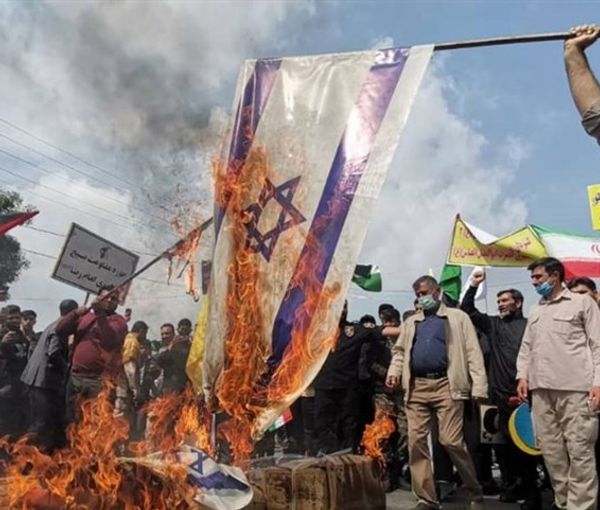 Quds Day crowd in the ritual of burning an Israeli flag in 2022