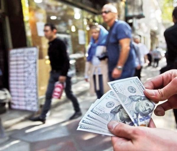  A man dealing dollar in a street in Iran 