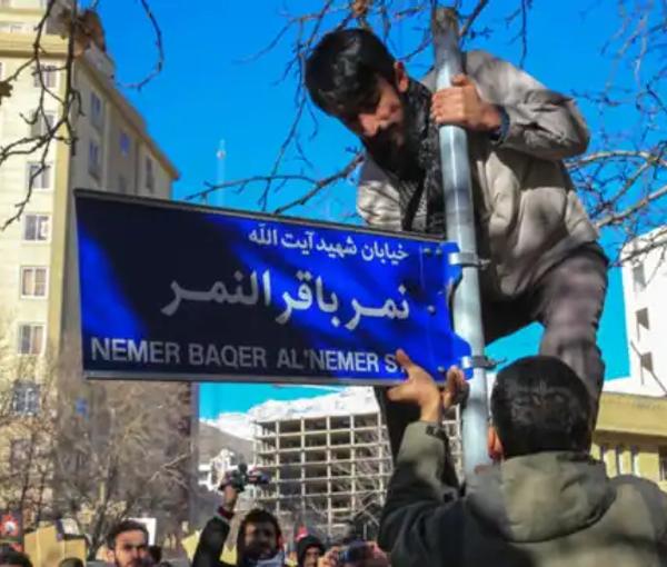 The street sign bearing the name of a Saudi Shiite cleric being installed in Iran, in 2016