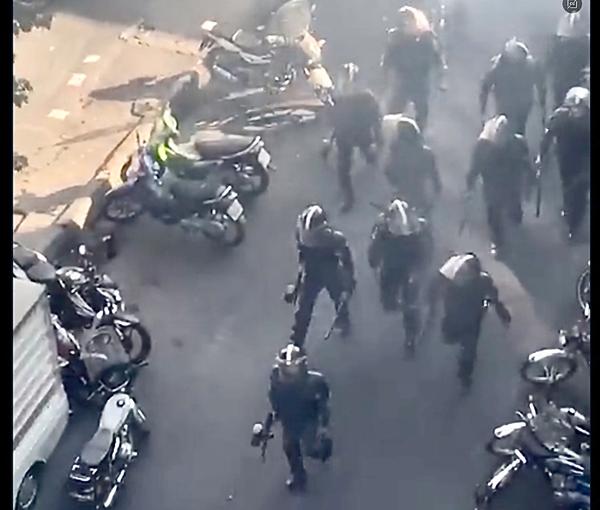 Iranian anti-riot troops in action against protesters in Tehran on October 12, 2022