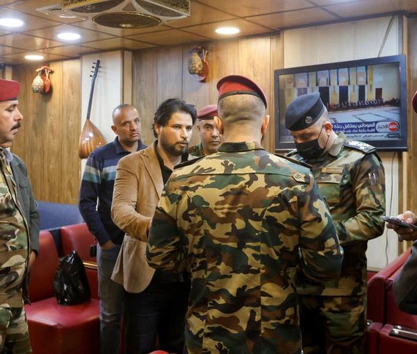 Iraqi security forces check people during a security operation to arrest dollar manipulators in Baghdad, Iraq, January 22, 2023. 
