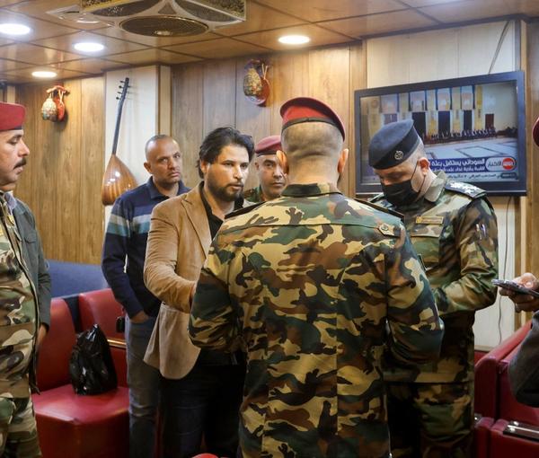 Iraqi security forces check people during a security operation to arrest dollar manipulators in Baghdad, Iraq, January 22, 2023.