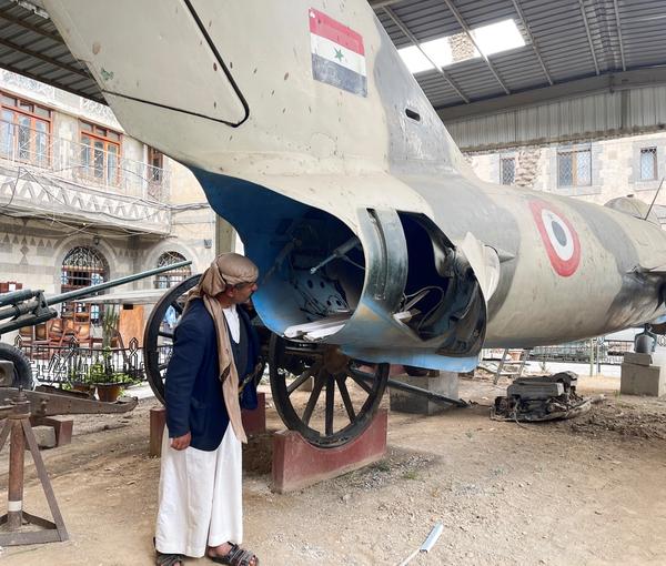 A man looks at a MiG-17 fighter aircraft put on a display at the Military Museum that gives Yemenis a glimpse of the conflicts their country has gone through, in Sanaa, Yemen, March 19, 2023. 