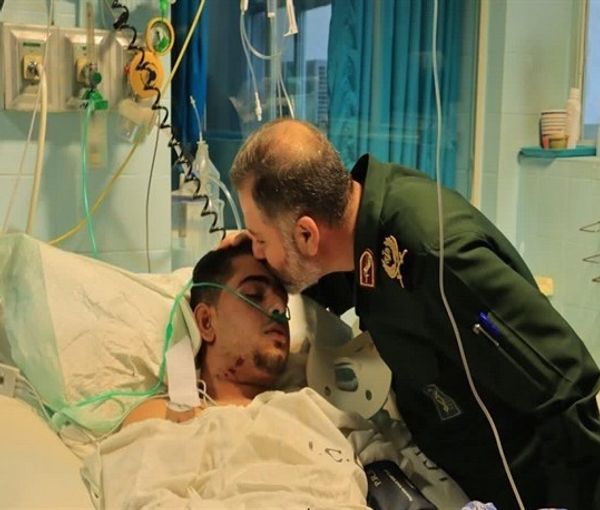 An Iranian IRGC commander visiting one of the agents injured during clashes with protesters (September 2022)